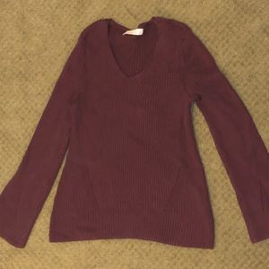 Scoop neck bell sleeve sweater.